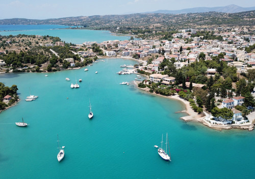 Village of Porto Heli with turquoise and emerald clear waters, Argolida, Peloponnese, Greece